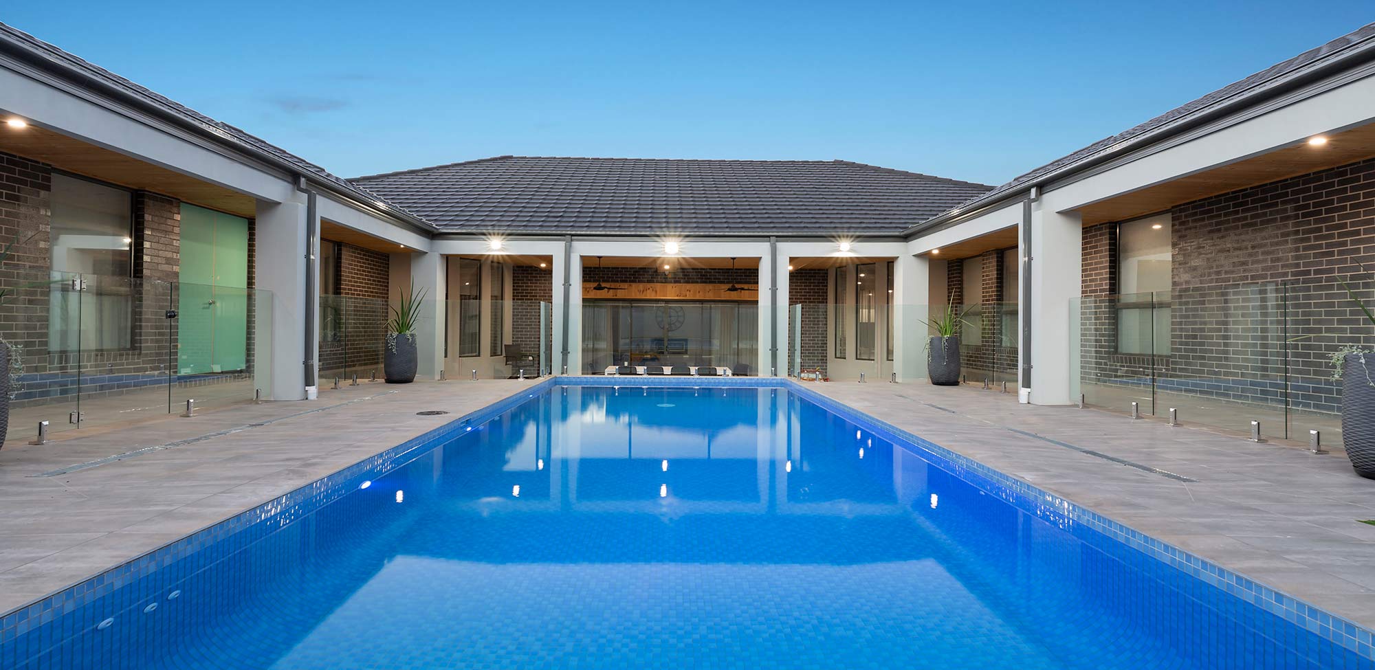 swimming pool with glass fencing
