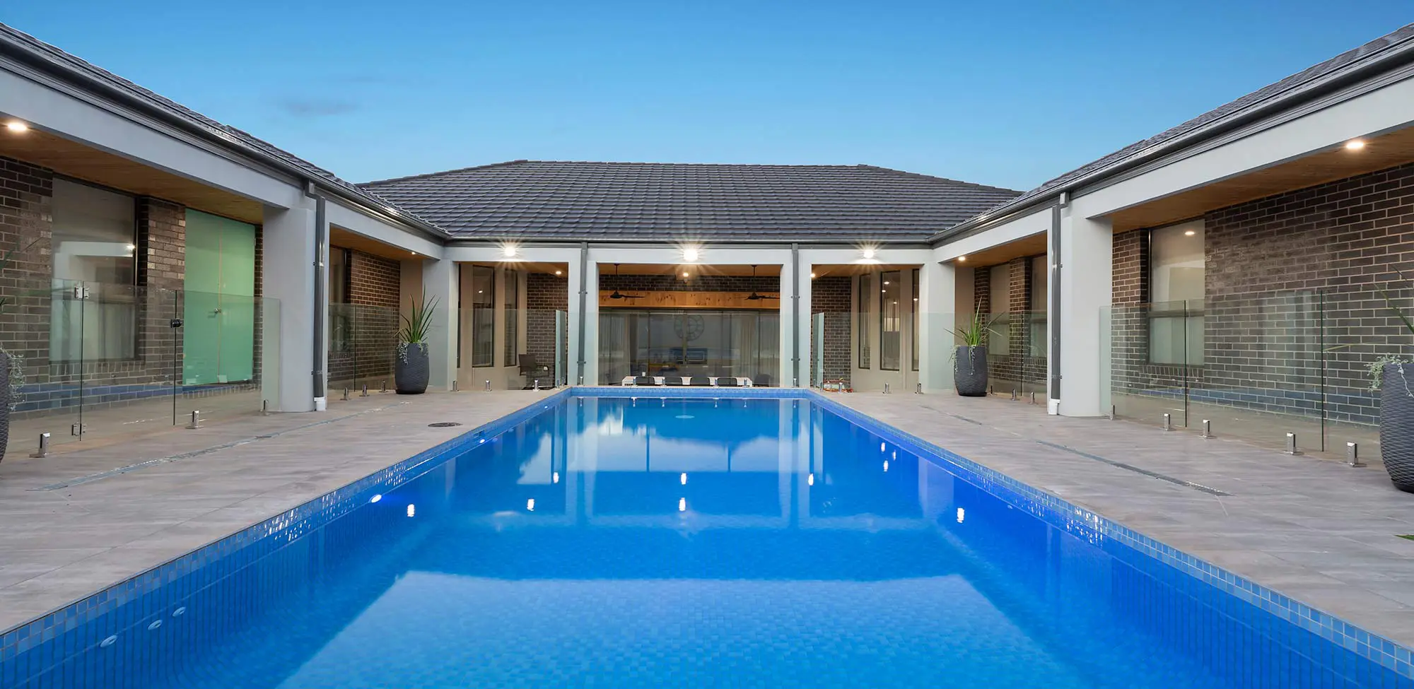 swimming pool with glass fencing